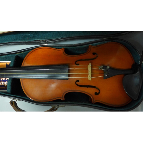 830 - A modern violin and bow, length of back 33.5cm, cased