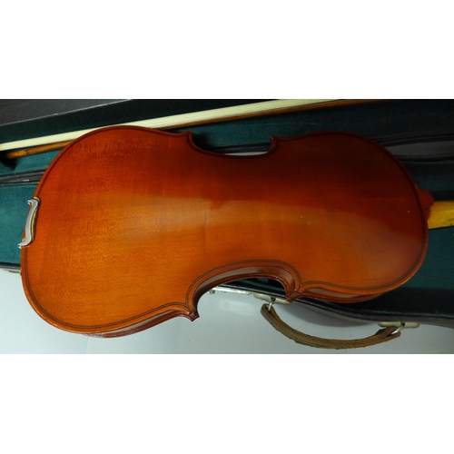 830 - A modern violin and bow, length of back 33.5cm, cased