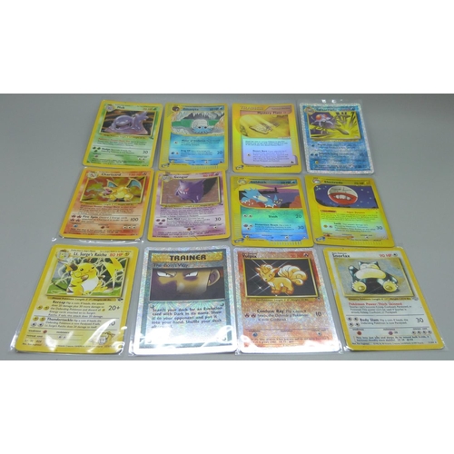 838 - Eleven Pokemon cards including base set 1995-1996 Charizard