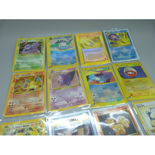 838 - Eleven Pokemon cards including base set 1995-1996 Charizard