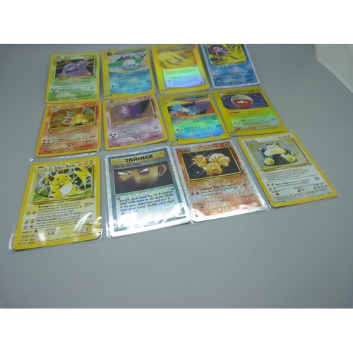 838 - Eleven Pokemon cards including base set 1995-1996 Charizard