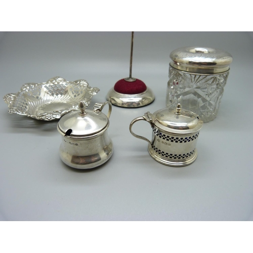 839 - A jewellery stand, a Victorian pierced silver dish, a silver topped glass hair tidy and two silver m... 