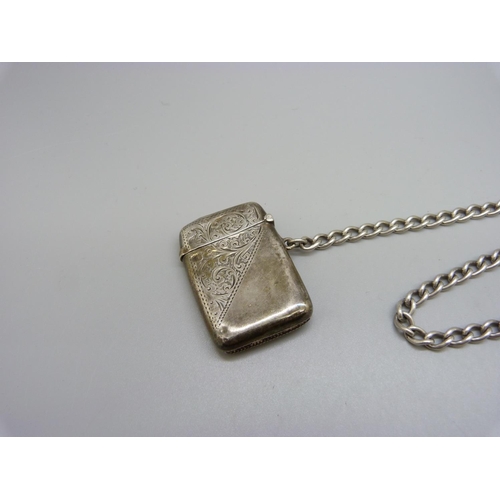 855 - A silver Albert watch chain and a silver vesta case, 47g