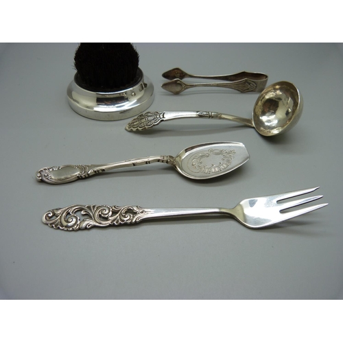 857 - A silver mounted pen wipe, an 830 silver Norwegian Mylius fork, a small ladle, etc.