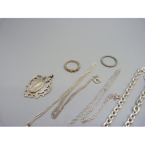 858 - A collection of silver including an Edwardian fob marked W.J.D, a dragonfly necklace, a silver chain... 