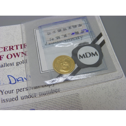 873 - Two small fine gold coins, 999/1000 Liberia 20 dollars, 1.25g, and a 999/1000 5 yuan, 1.56g