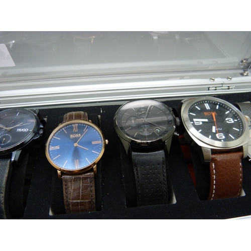 876 - A case of six wristwatches, all Hugo Boss