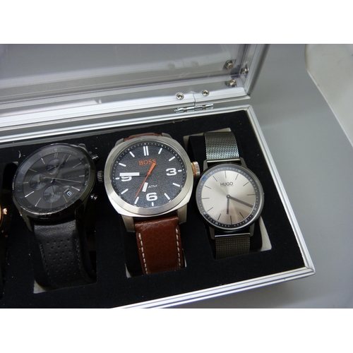 876 - A case of six wristwatches, all Hugo Boss