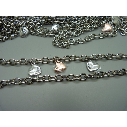 884 - A collection of approximately thirty-four Fiorelli designer chain necklaces with hearts