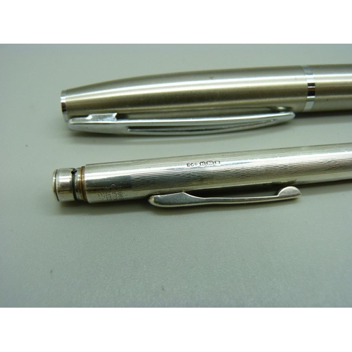 896 - A silver Eversharp propelling pencil and two fountain pens