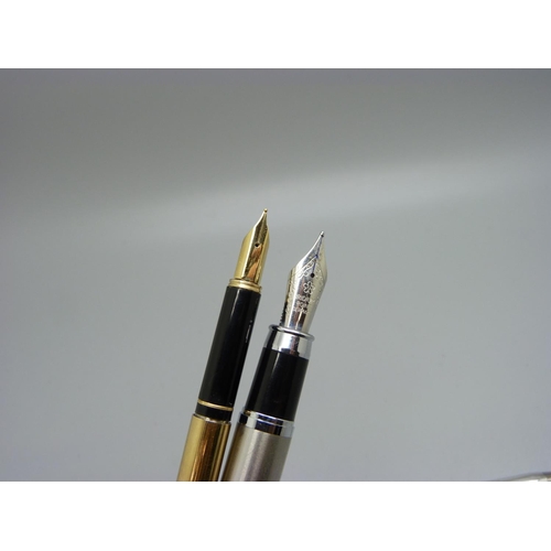 896 - A silver Eversharp propelling pencil and two fountain pens