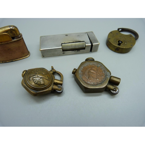 901 - A Dunhill lighter, a/f, two trench art type lighters, one other and a padlock