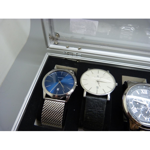 923 - A case of six wristwatches, Sekonda, Accurist, Guess, Pulsar and Limit