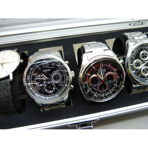 923 - A case of six wristwatches, Sekonda, Accurist, Guess, Pulsar and Limit