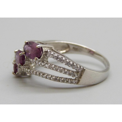 956 - A 9ct white gold magenta garnet and white sapphire ring, 3.5g, S