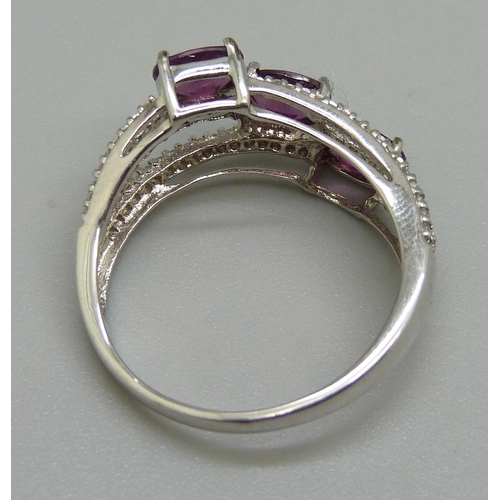 956 - A 9ct white gold magenta garnet and white sapphire ring, 3.5g, S