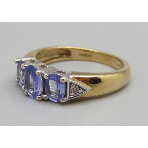 957 - A 9ct gold, tanzanite and diamond ring, 3.1g, L