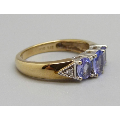 957 - A 9ct gold, tanzanite and diamond ring, 3.1g, L