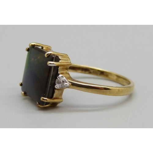 963 - A 9ct gold ring set with ammolite, 2.6g, N