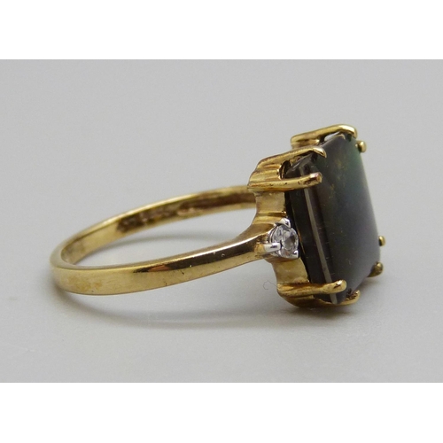 963 - A 9ct gold ring set with ammolite, 2.6g, N