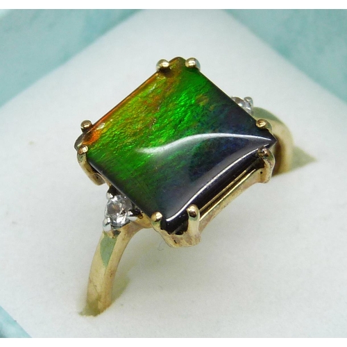 963 - A 9ct gold ring set with ammolite, 2.6g, N