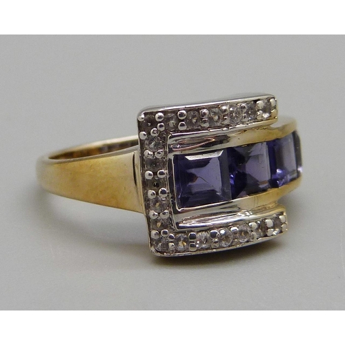 969 - A silver gilt, iolite set buckle ring, M