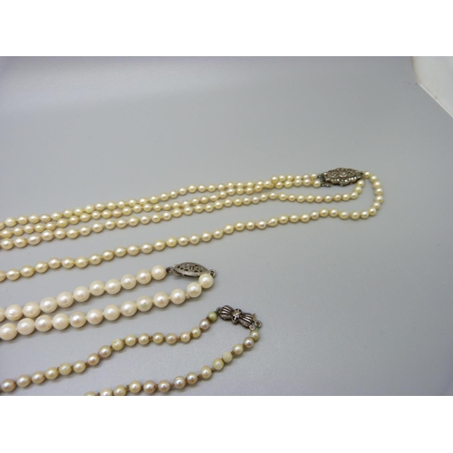 975 - Three pearl necklaces and four pairs of earrings