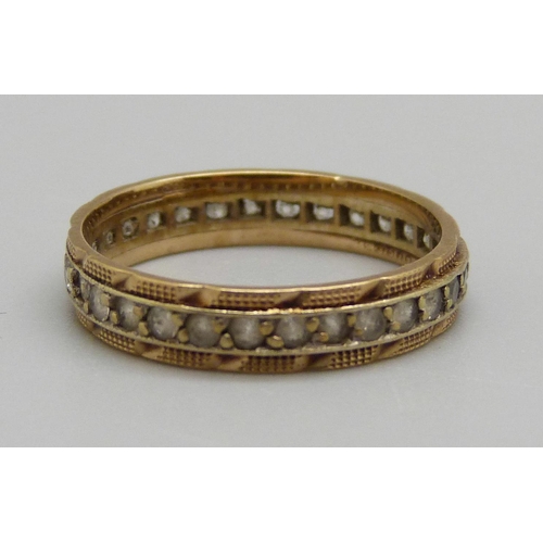 981 - A 9ct gold and white stone eternity ring, 1.9g, N