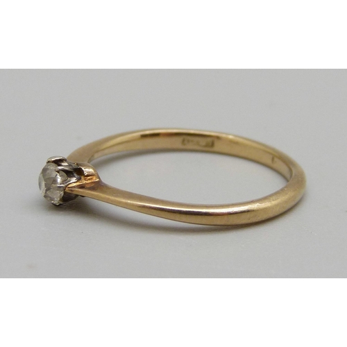 982 - An 18ct gold ring set with a white stone, 1.8g, L