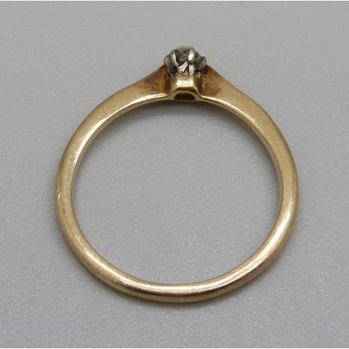 982 - An 18ct gold ring set with a white stone, 1.8g, L