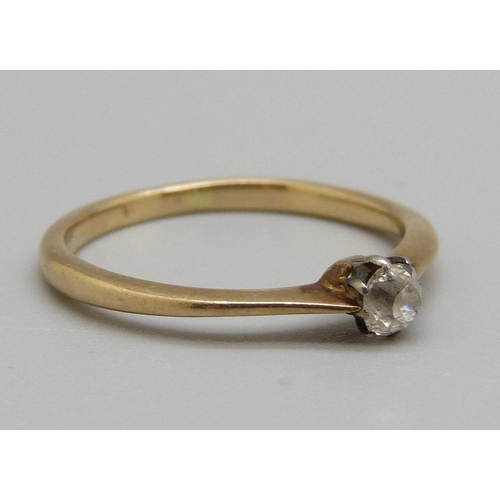 982 - An 18ct gold ring set with a white stone, 1.8g, L