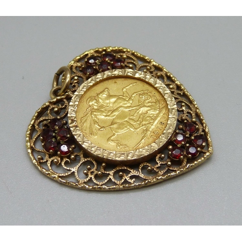 998 - A George V 1913 full sovereign in a 9ct gold heart shaped mount set with garnets, total weight 16.1g... 