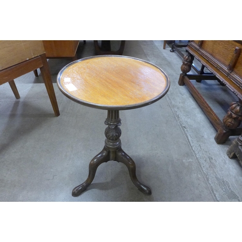 105 - A Chippendale style carved mahogany tripod wine table