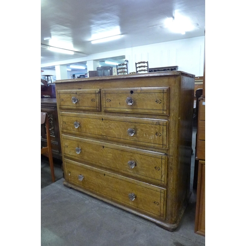 111 - A Victorian scumbled pine chest of drawers