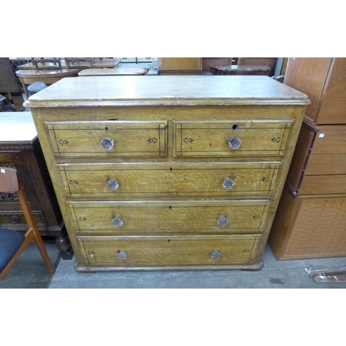 111 - A Victorian scumbled pine chest of drawers