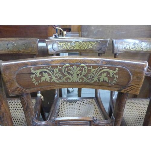 121 - A set of eight Regency rosewood and brass inlaid chairs, a/f