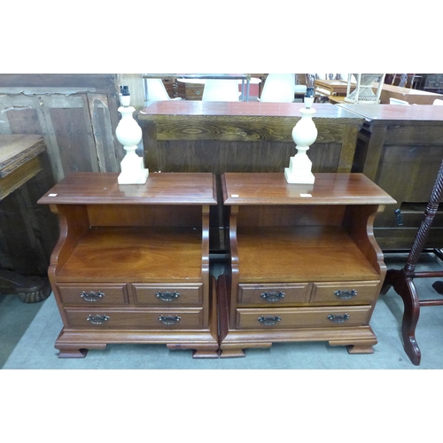 126 - A pair of mahogany bedside cabinets and two alabaster lamps