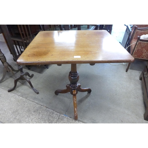 132 - A Victorian mahogany rectangular tilt top tripod table