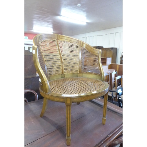 141 - An Edward VII inlaid mahogany bergere library chair