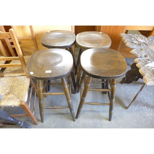 146 - A set of four beech bar stools