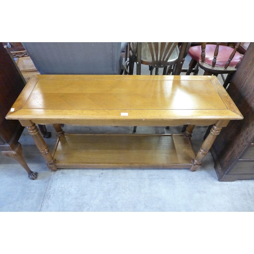 153 - An oak effect serving table