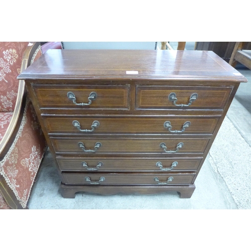 160 - An inlaid mahogany chest of drawers