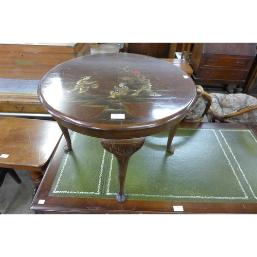 165 - A Japanned walnut circular coffee table