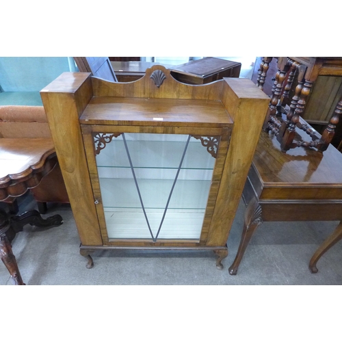 174 - An early 20th Century walnut display cabinet