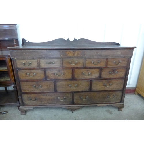 176 - A George II inlaid mahogany fourteen drawer Lancashire chest