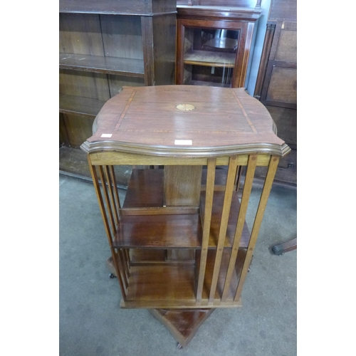 181 - An Edward VII inlaid mahogany revolving bookcase