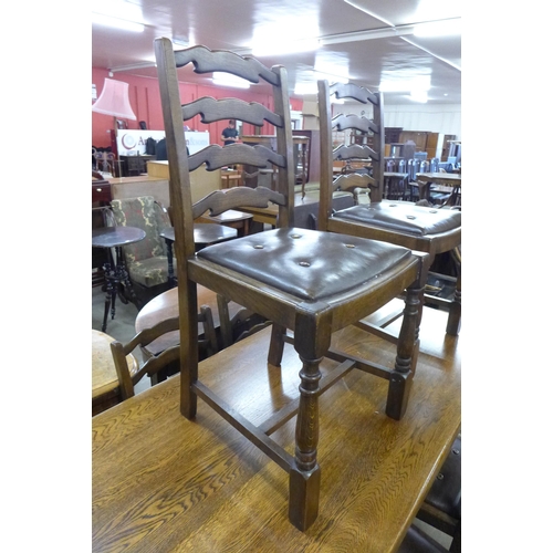 190 - An oak refectory table and six elm ladderback chairs