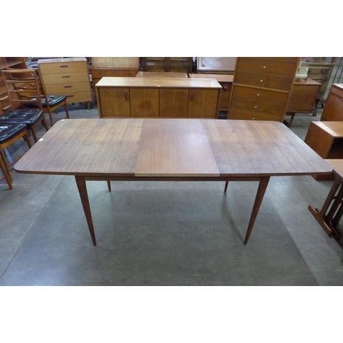 21 - An Archie Shine teak extending Hamilton dining table, designed by Robert Heritage