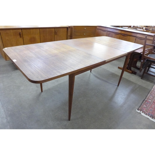 21 - An Archie Shine teak extending Hamilton dining table, designed by Robert Heritage