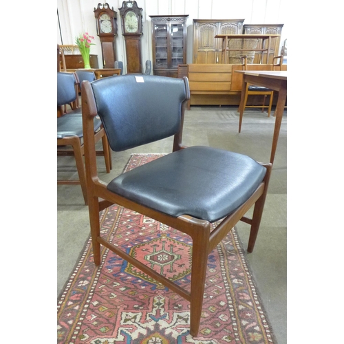 22 - A set of four G-Plan Danish Design teak and black vinyl chairs, designed by Ib Kofod Larsen